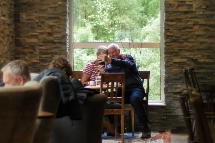 Two old people taking a selfie