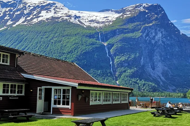 a house with a mountain in the background
