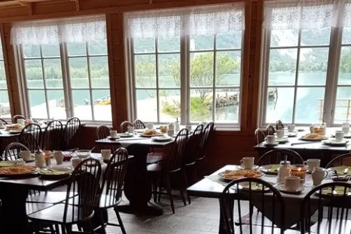 a dining room table in front of a window