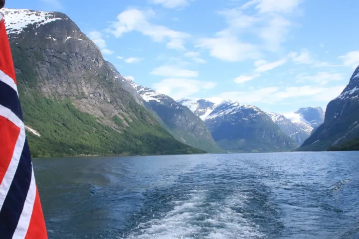 a view of water and a mountain in the background