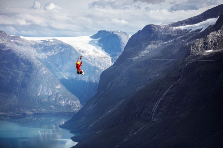 a man standing on top of a snow covered mountain